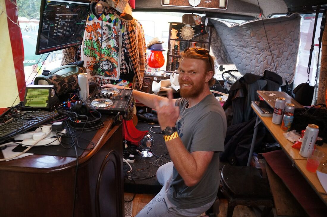 Guests being served at the mahogany bar on board The Love Bus