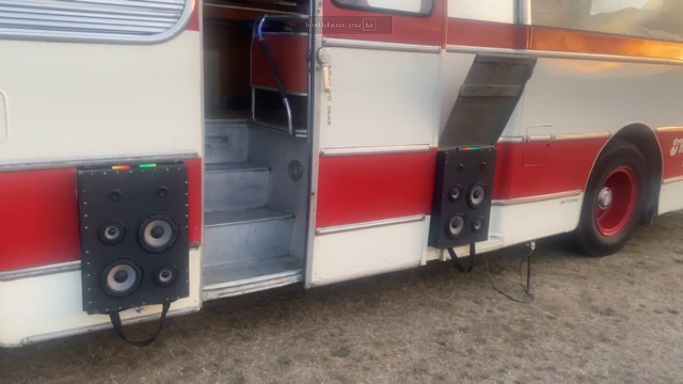 External sound system speakers on the side of The Love Bus