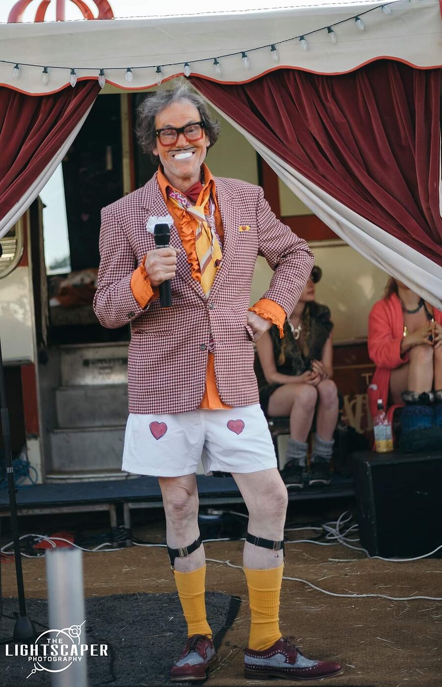 The Great Lorenzo performing outside The Love Bus