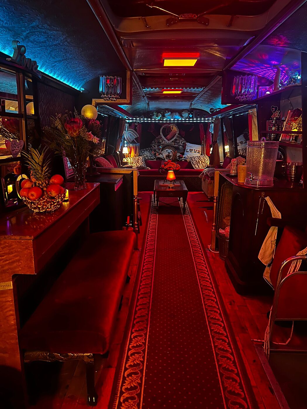 The Love Bus interior at night, set up for a performance