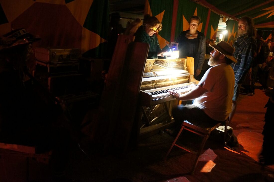 An evening piano session on board The Love Bus